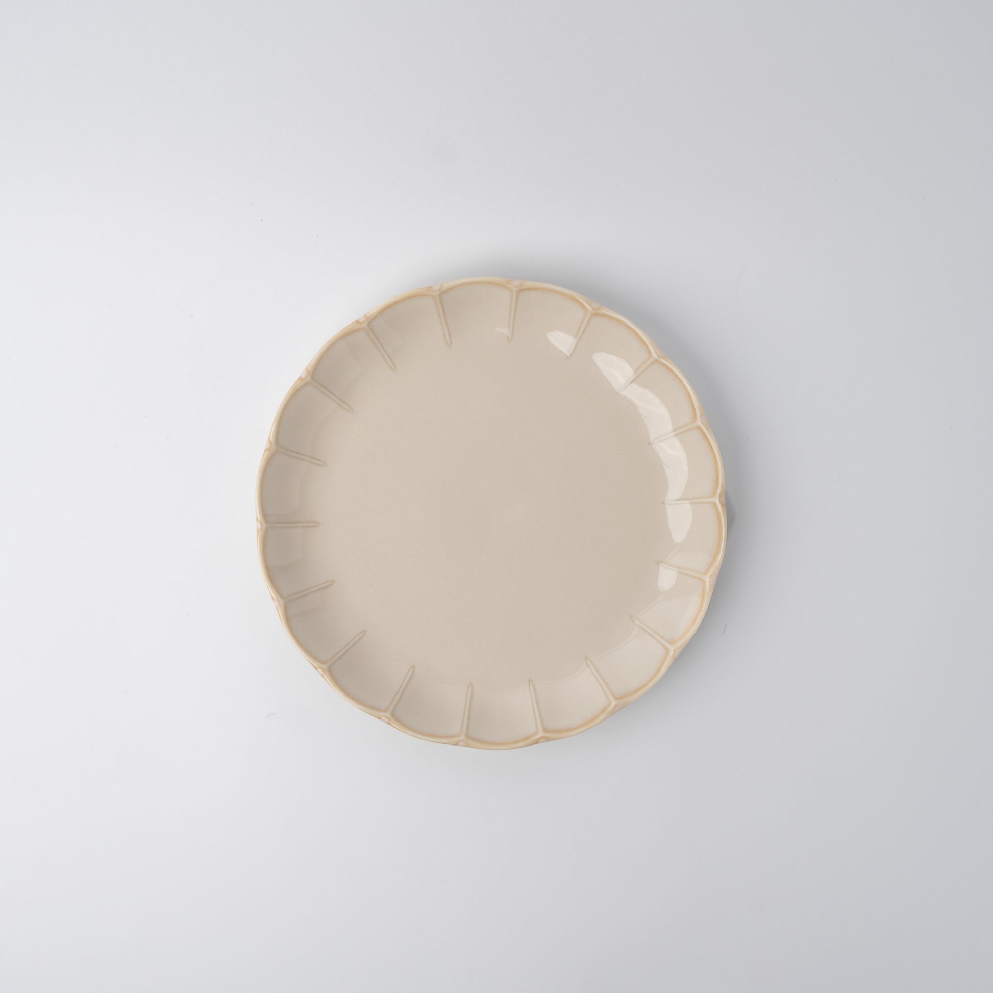 Handmade 21cm ceramic side plate in ivory glaze with scalloped edge