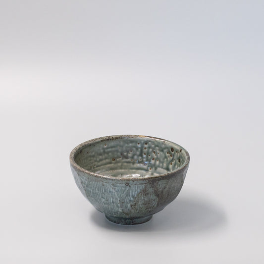 17cm ceramic bowl with smooth green glaze and simple, versatile design.