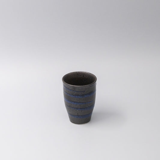 Handcrafted ceramic sushi mug with bright blue spiral pattern on black base, Japanese tableware for serving green tea, miso soup, or hot beverages