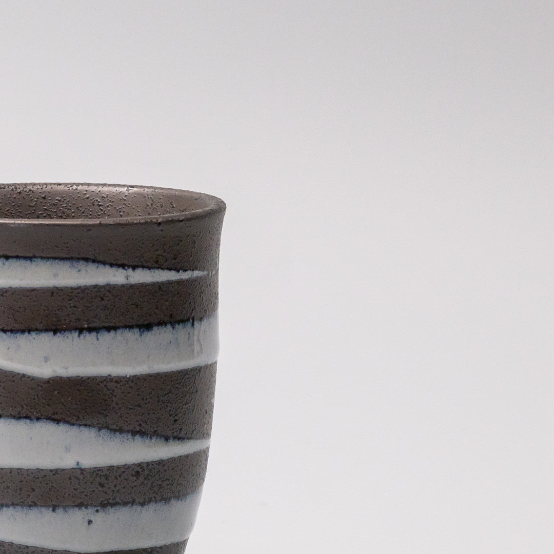 Light blue spiral pattern on black ceramic sushi mug, 300ml capacity.