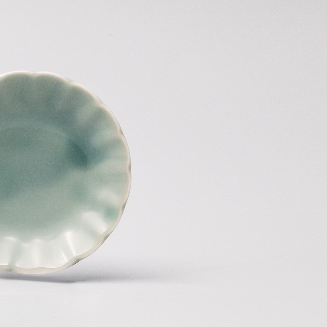 Japanese mamezara small dish with scalloped edges in soft aqua glaze, perfect for soy sauce, dipping oils, or small treats
