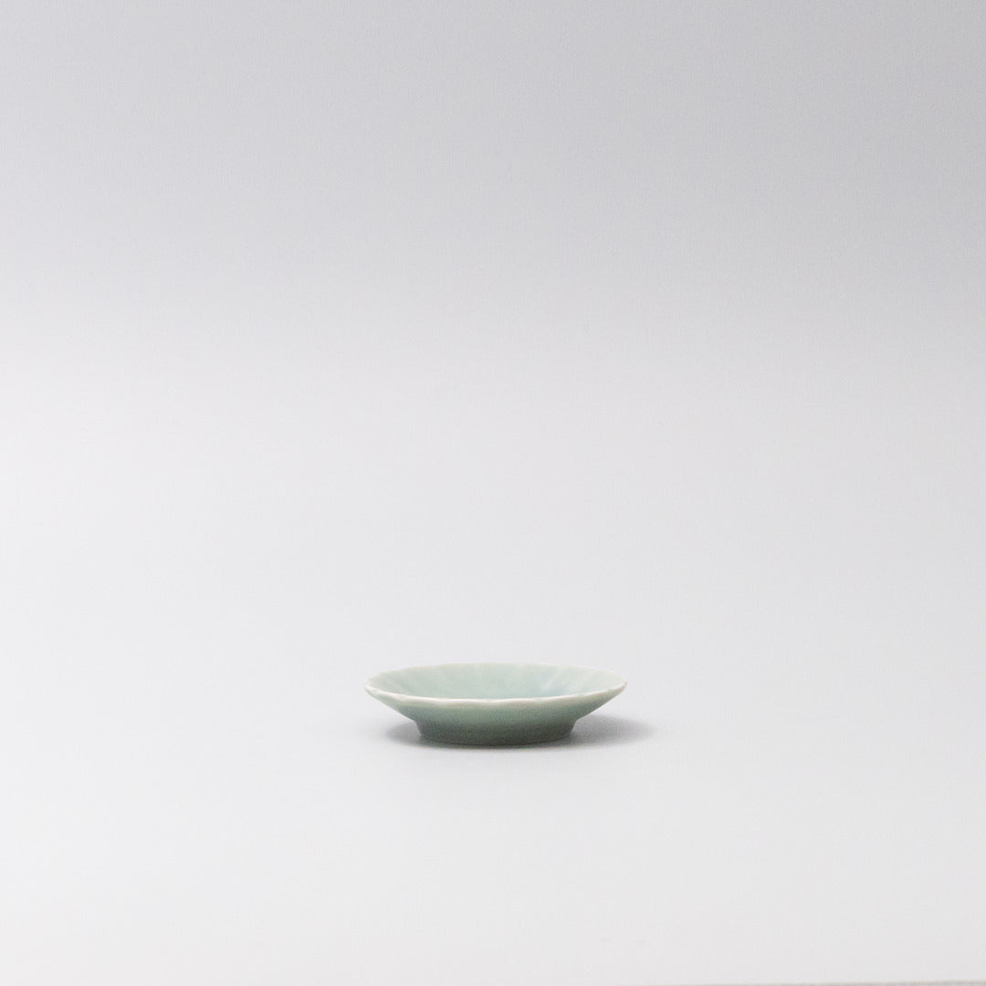 Japanese mamezara small dish with scalloped edges in soft aqua glaze, perfect for soy sauce, dipping oils, or small treats