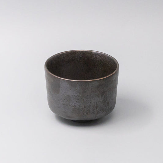 Eclipse matcha tea bowl with deep dark tones and rounded shape, handcrafted Japanese ceramic for preparing and drinking matcha tea