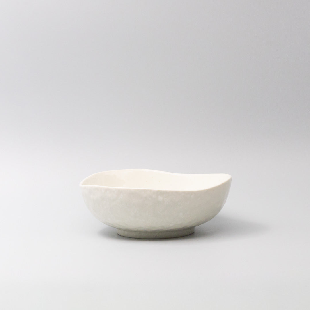 White ceramic bowl with organic curved shape and smooth finish