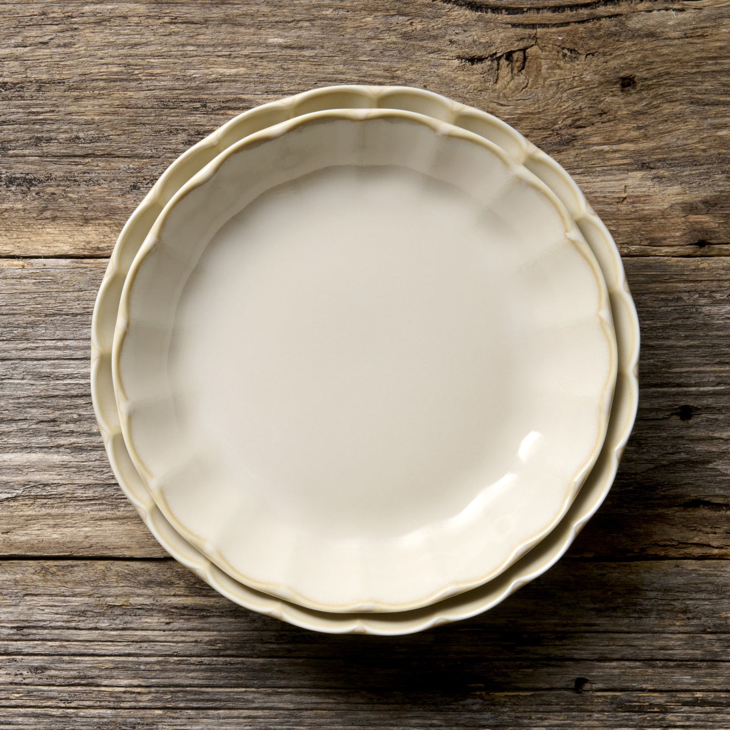 Handmade 21cm ceramic side plate in ivory glaze with scalloped edge