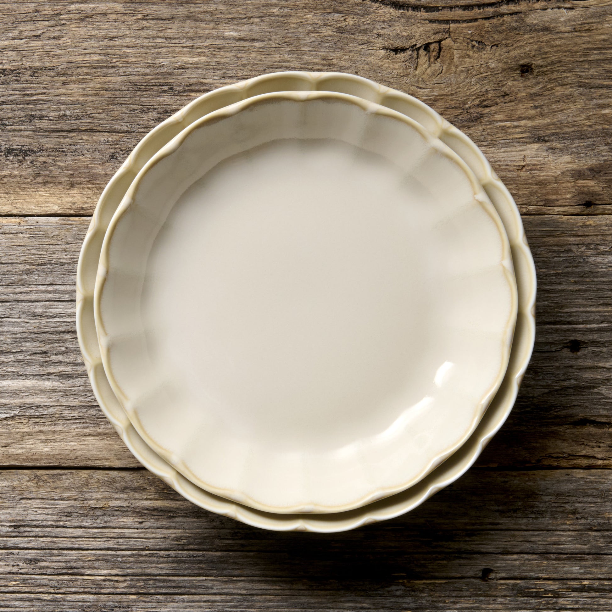 Handmade 21cm ceramic side plate in ivory glaze with scalloped edge