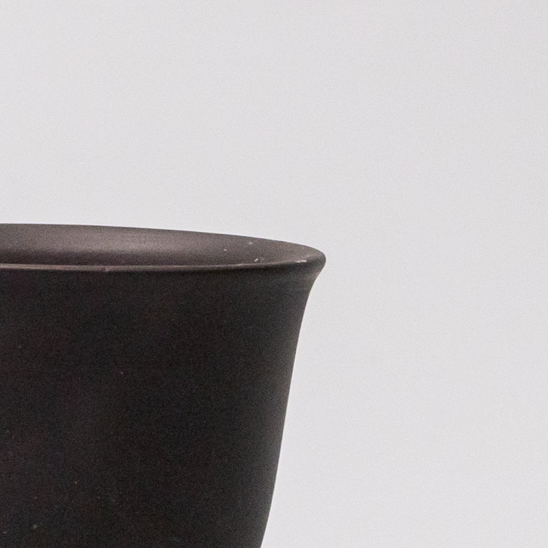 6cm ceramic sake tea cup black matte flared glaze close up matte texture detail