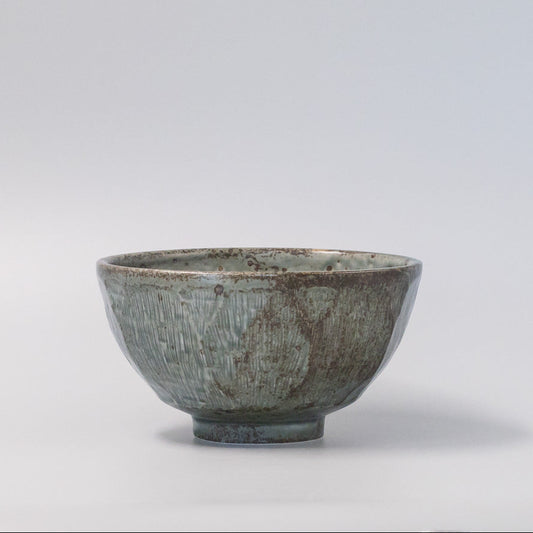17cm ceramic bowl with smooth green glaze and simple, versatile design.