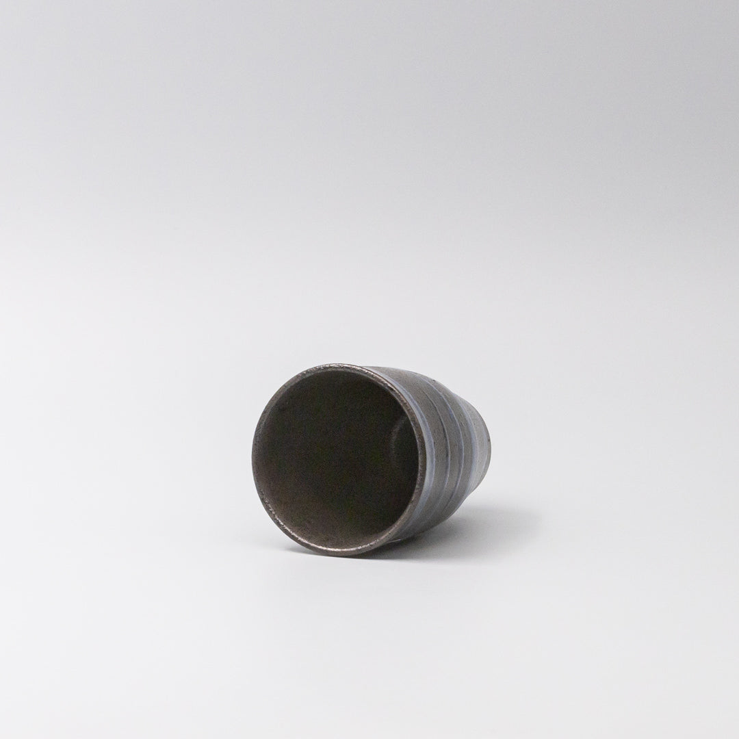 Handcrafted ceramic sushi mug with bright blue spiral pattern on black base, Japanese tableware for serving green tea, miso soup, or hot beverages