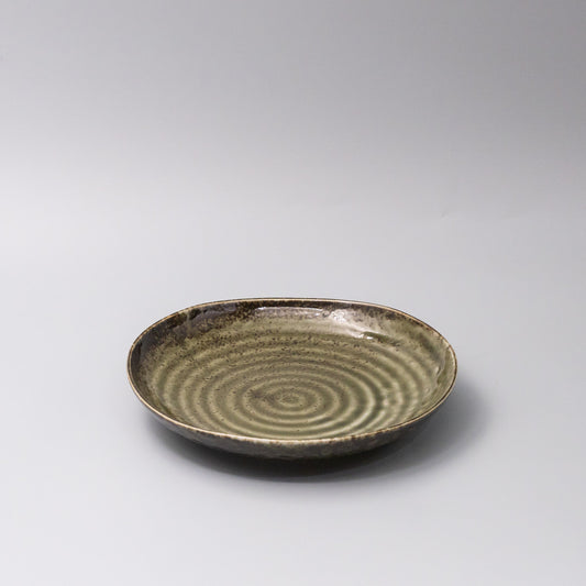 Organic sage green glaze ceramic dinner plate 45 degree view Japanese tableware
