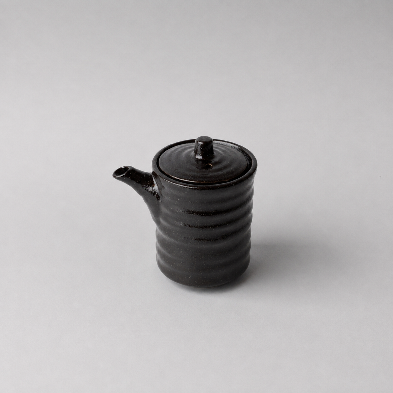 Front view of Black Ribbed Japanese ceramic soy pot made in Japan