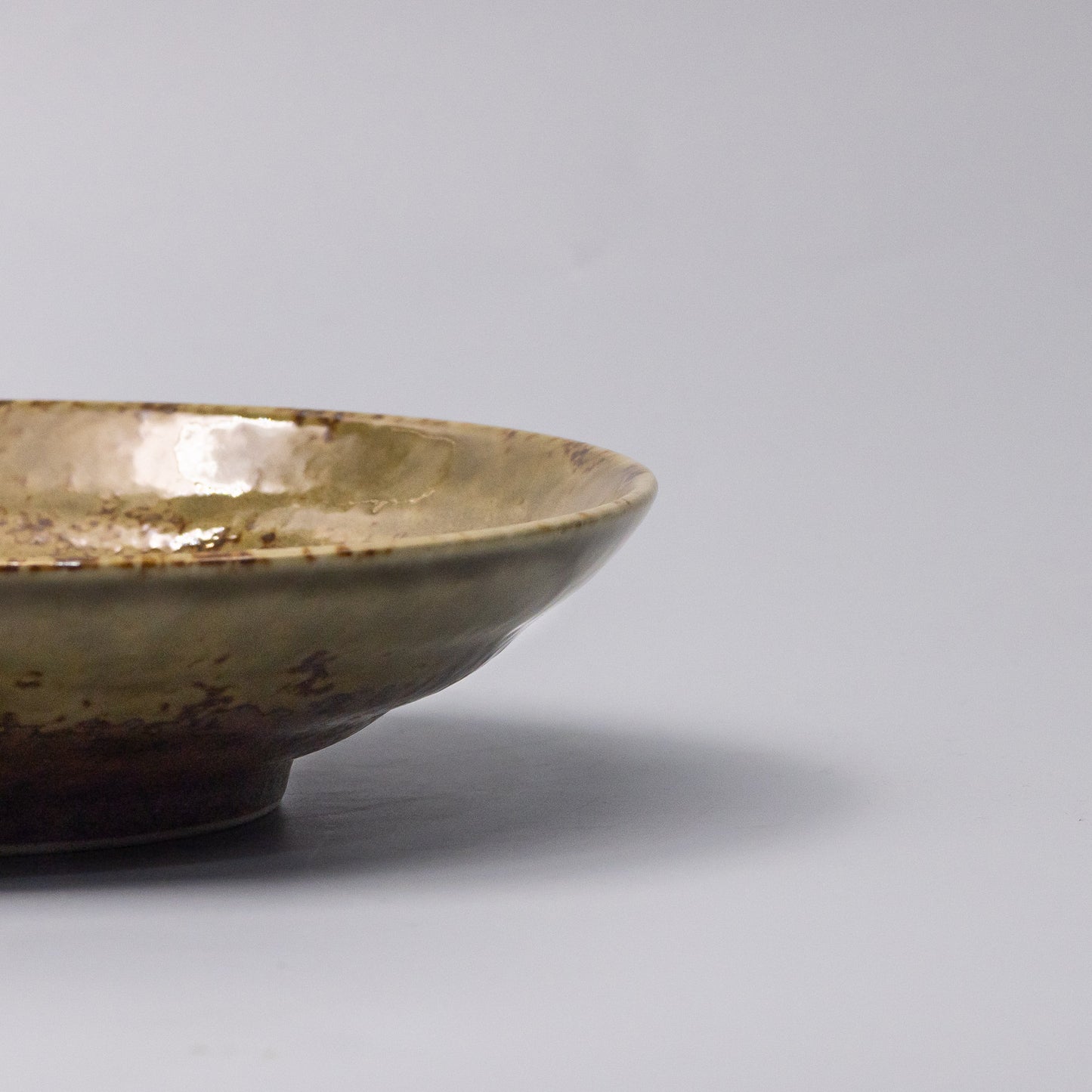 Pasta Bowl 23cm Chestnut Glaze close-up showing spiral centre and speckled glaze