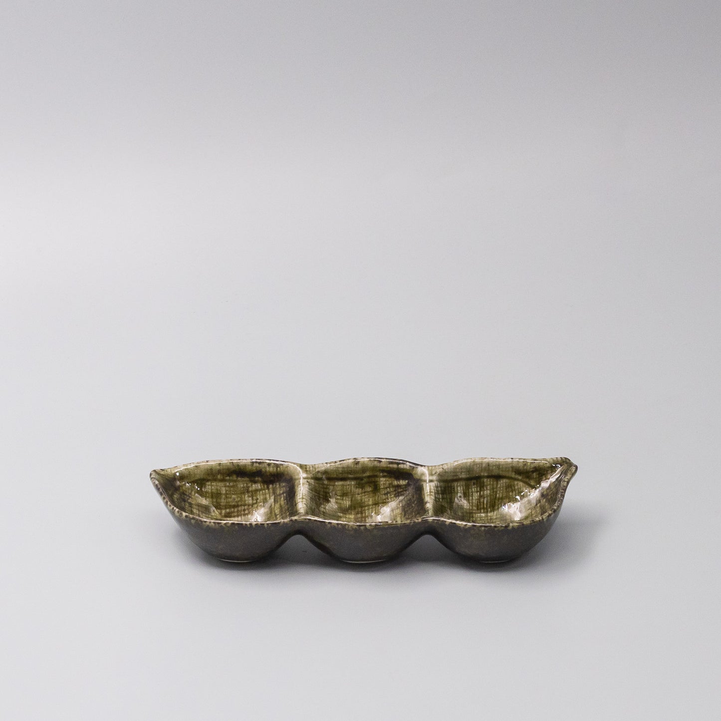 45-degree view of Green Glaze Edamame Triple Pod Dish