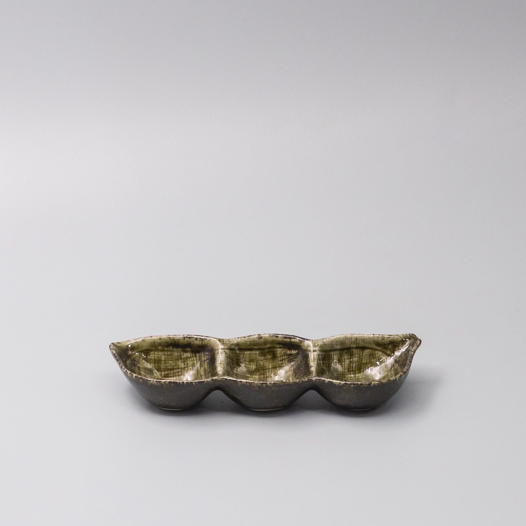 45-degree view of Green Glaze Edamame Triple Pod Dish