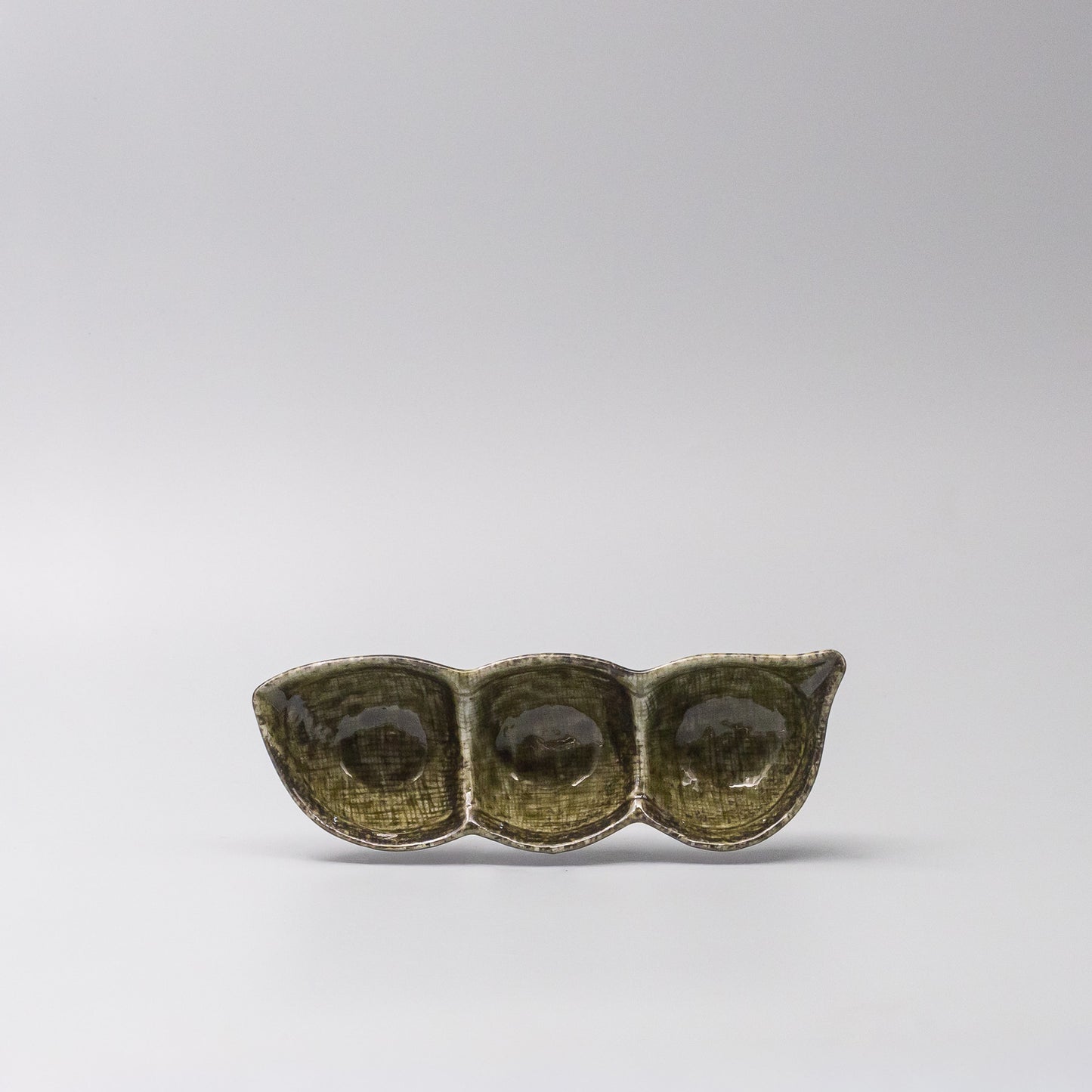 Front view of Green Glaze Edamame Triple Pod Dish made in Japan