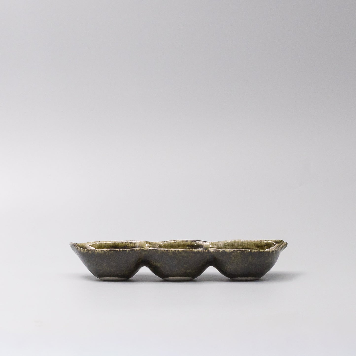 Side view of Green Glaze Edamame Triple Pod Dish