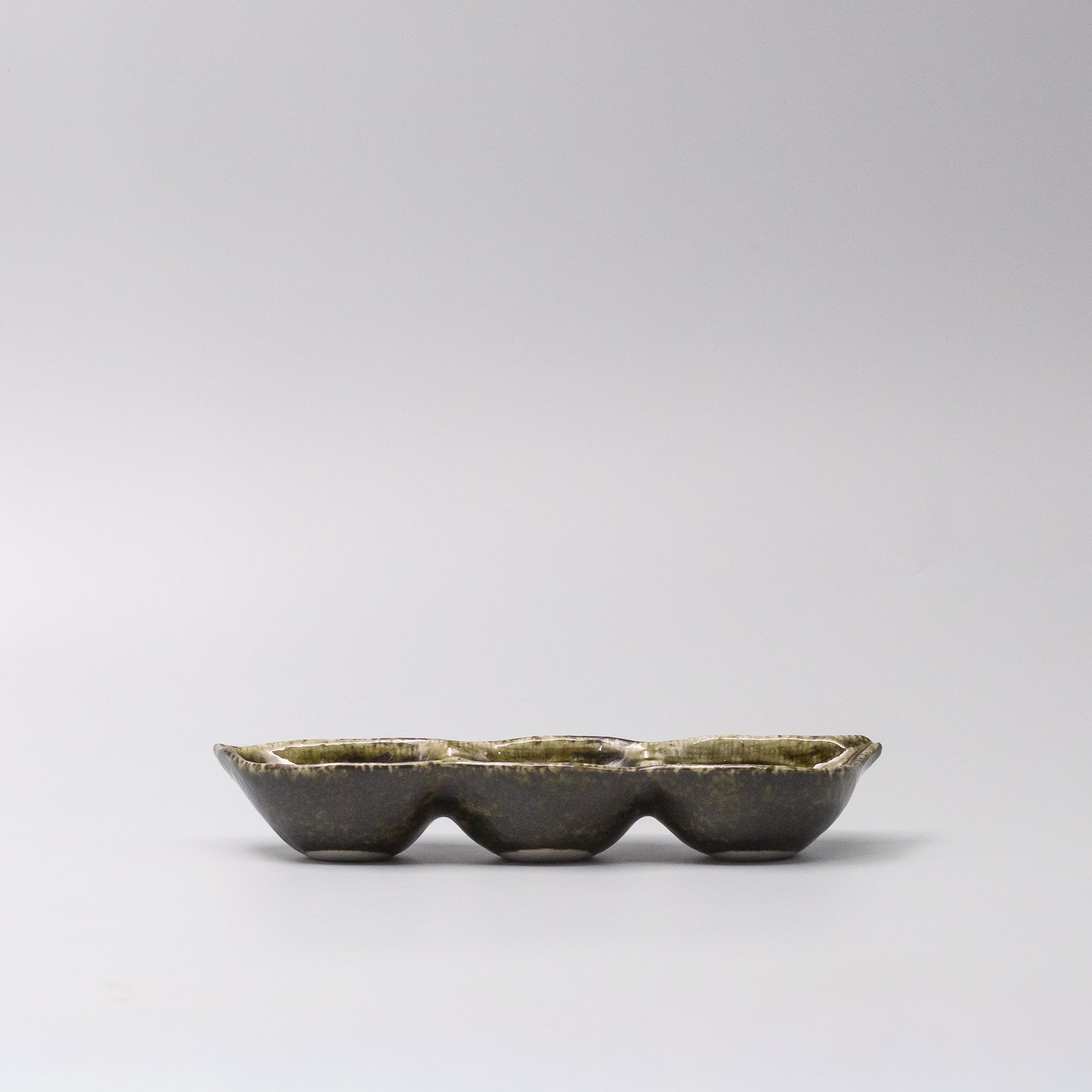 Side view of Green Glaze Edamame Triple Pod Dish