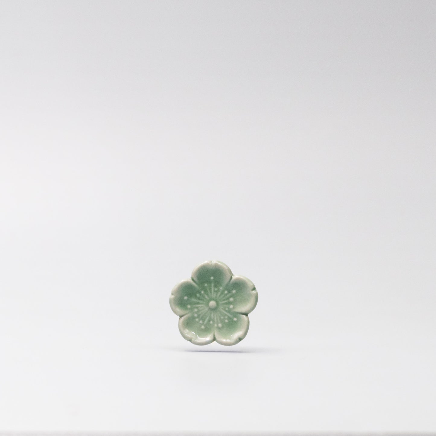Front view of Green Sakura Chopsticks Rest made in Japan