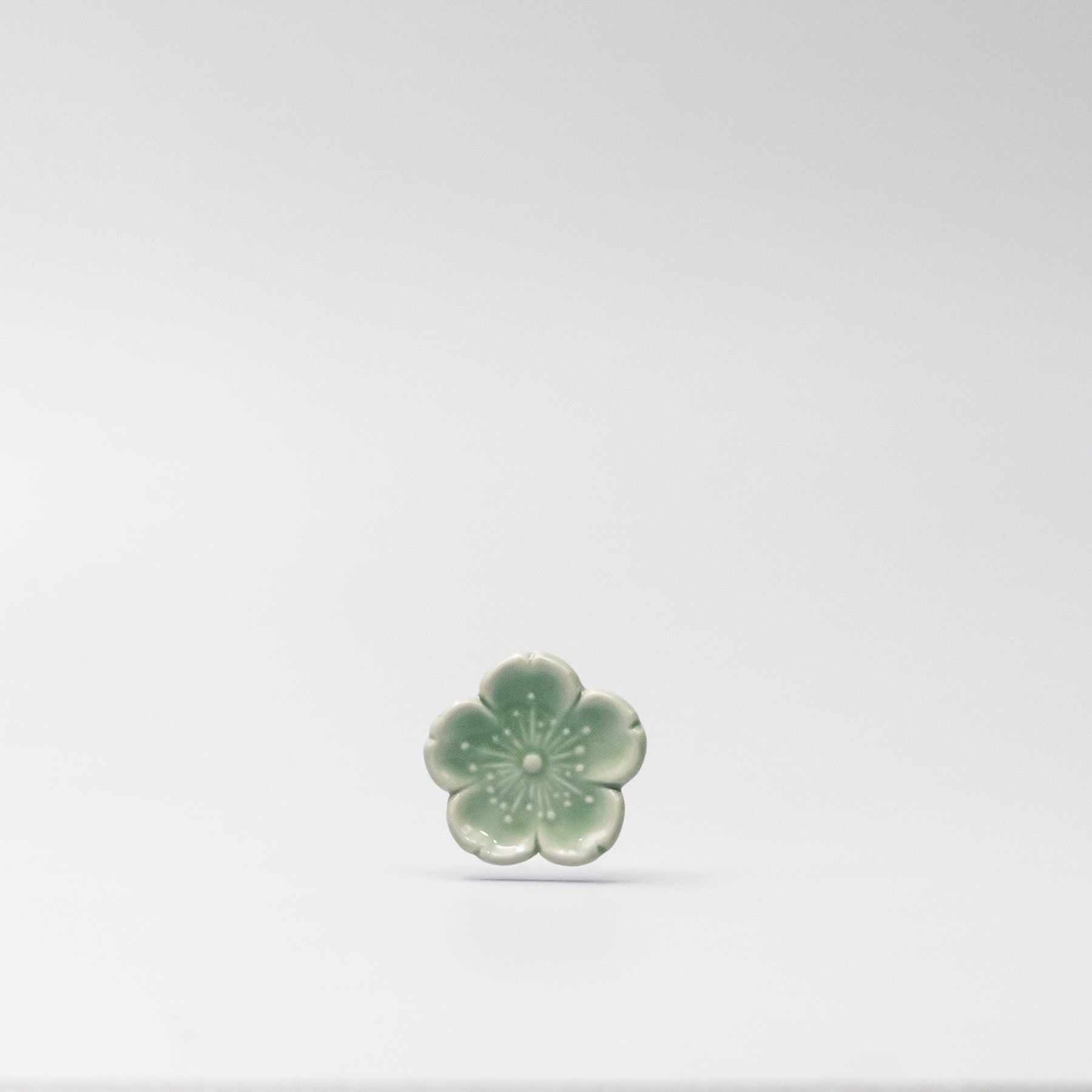 Front view of Green Sakura Chopsticks Rest made in Japan