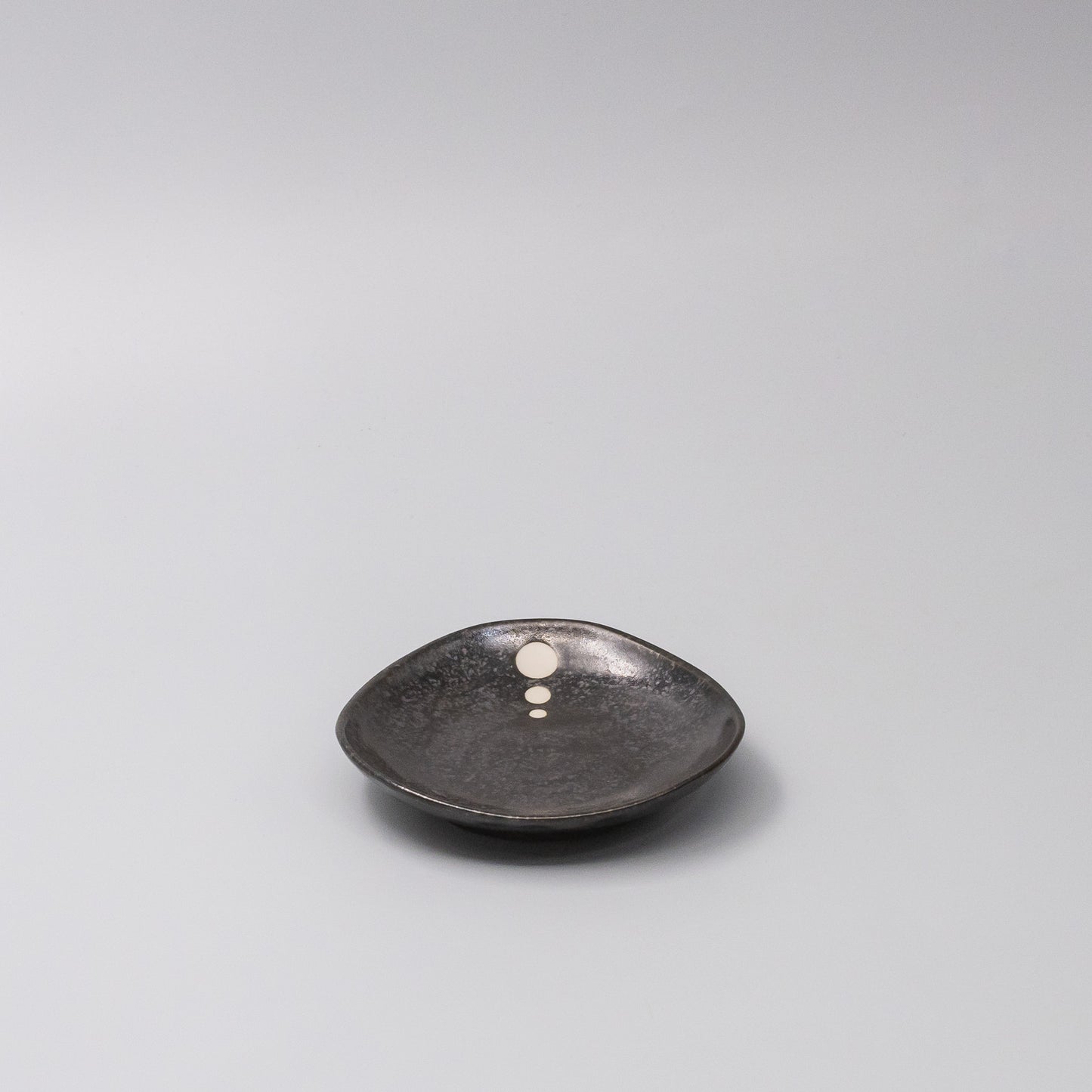 45-degree view of White Dot Design Organic Saucer 12cm
