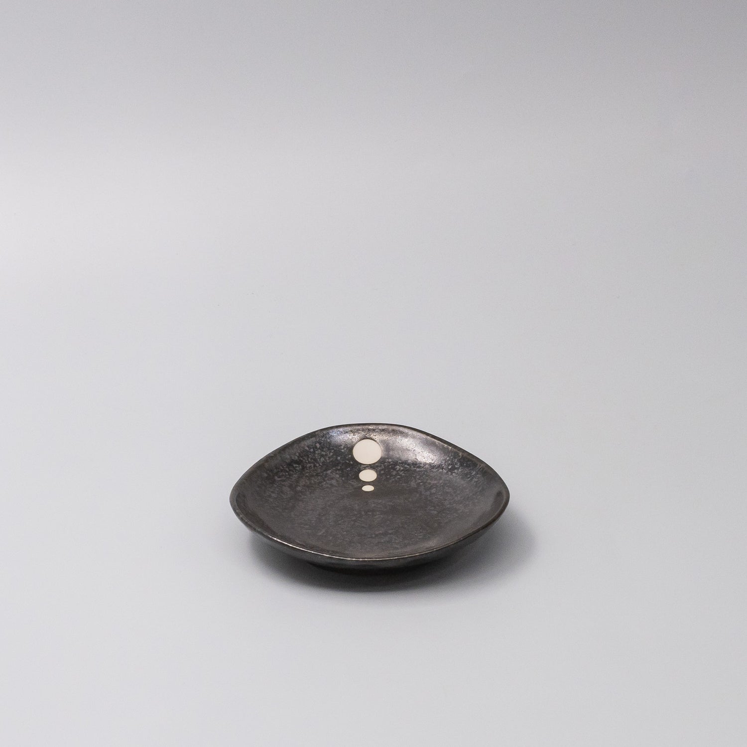 45-degree view of White Dot Design Organic Saucer 12cm