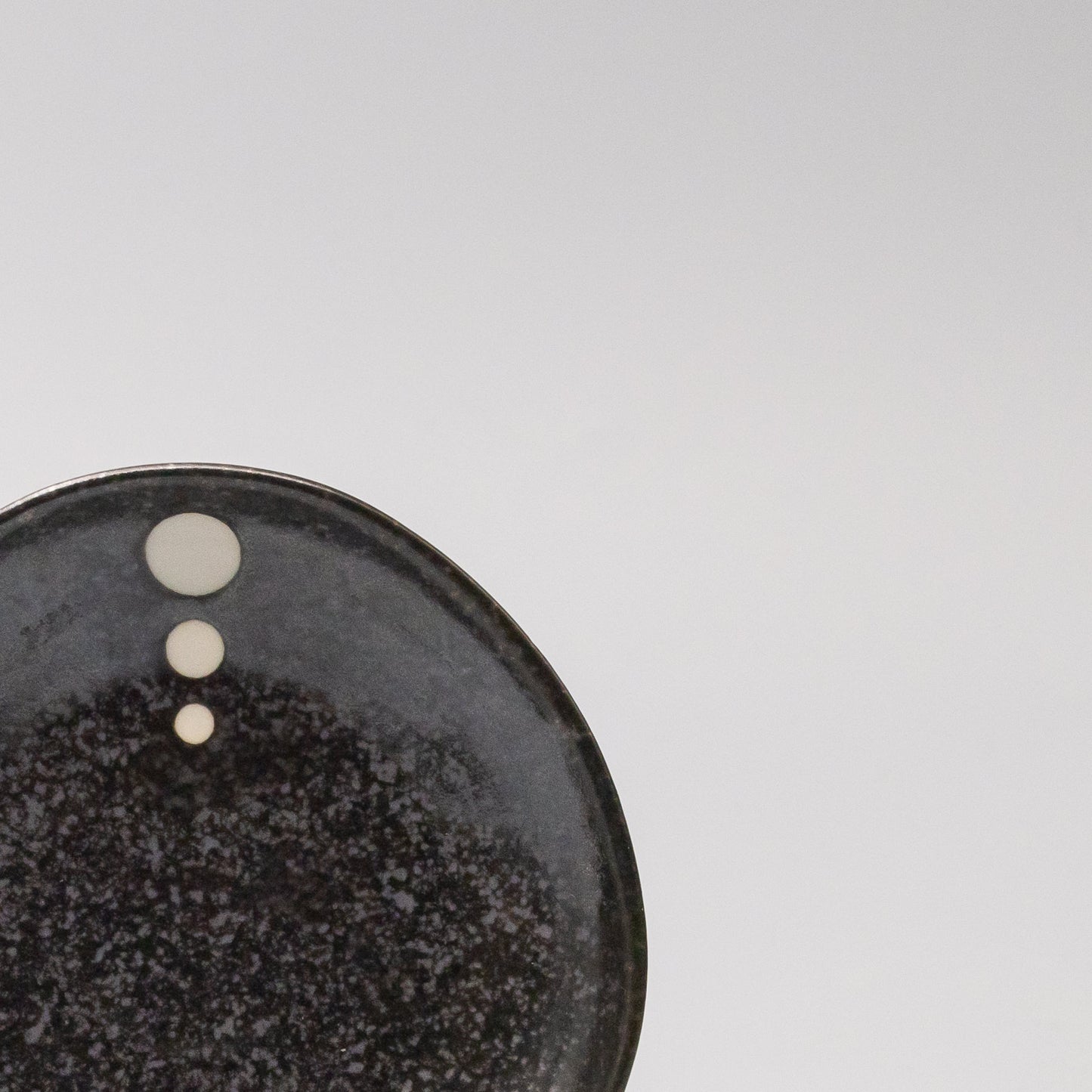 Close-up of the White Dot Design on the Organic Saucer 12cm