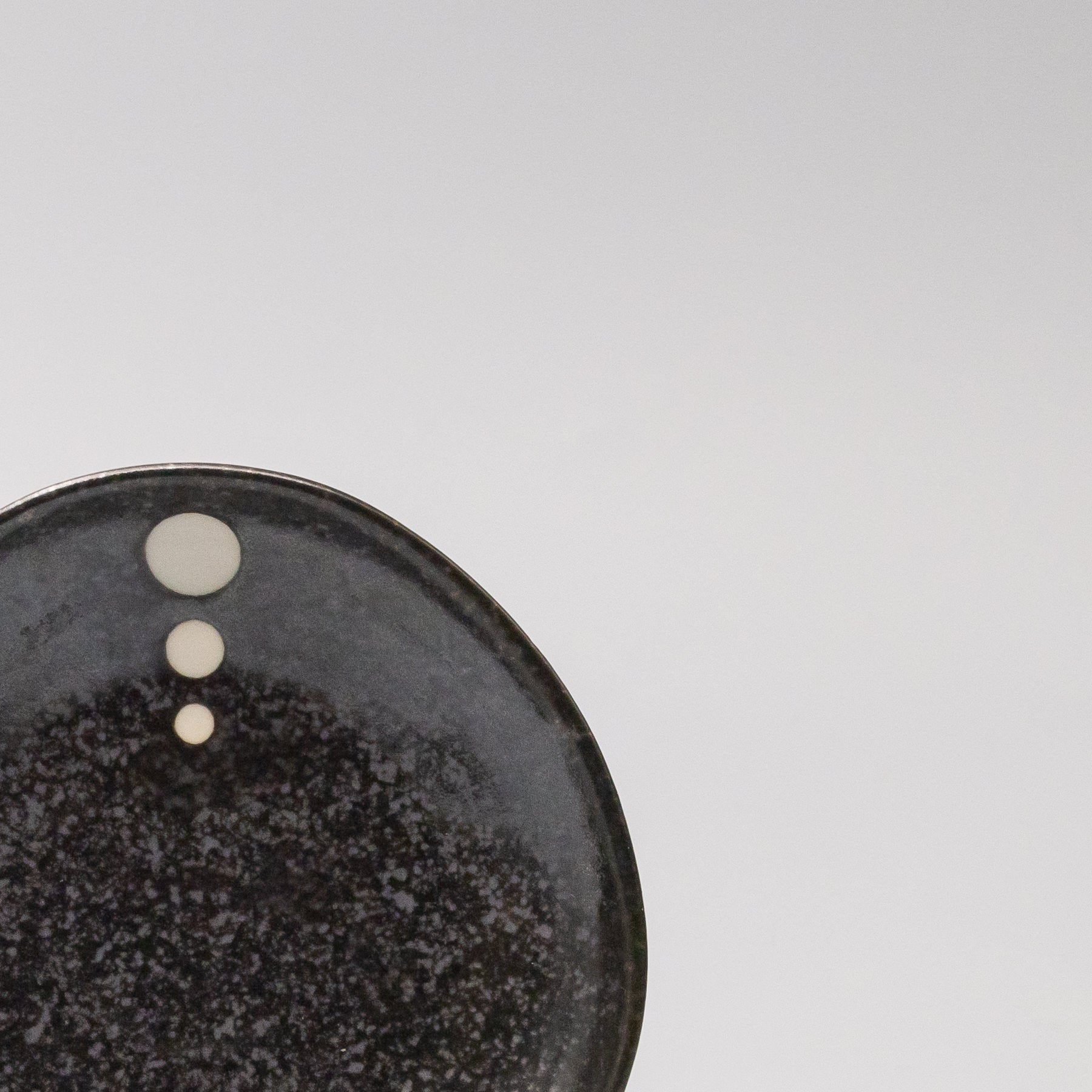 Close-up of the White Dot Design on the Organic Saucer 12cm